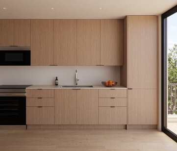 Oak kitchen cabinets and white quartz counter tops by Stack, a new line of interior FF&E | Turnkey FF&E & Interiors | The Living Company | Garland, Texas