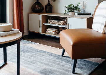 Student housing coffee table, media stand and lounge chair in a student dorm | Turnkey FF&E & Interiors | The Living Company | Garland, Texas